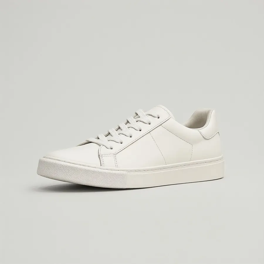 A white sneaker on a grey background